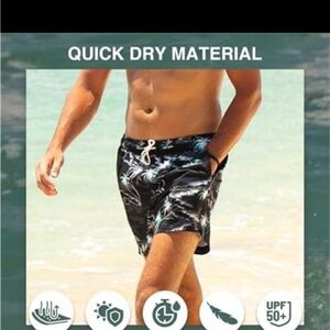 Kanu Surf Black Swim Shorts with Blue & White Tropical Print